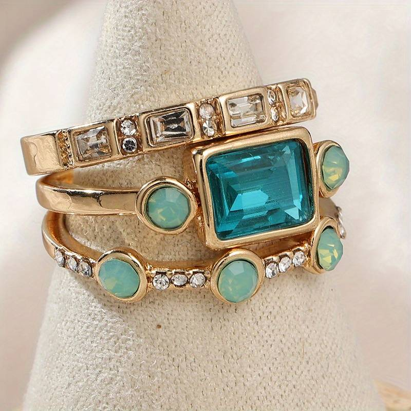 Silberfarbener Vintage-Ring mit blauem Kristall 